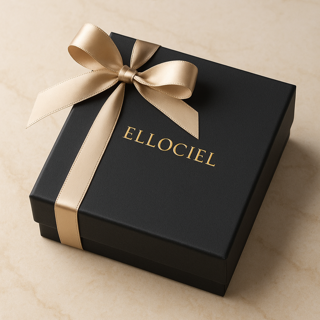 Black gift box with a gold ribbon and 'ELLOCIEL' branding on a beige background