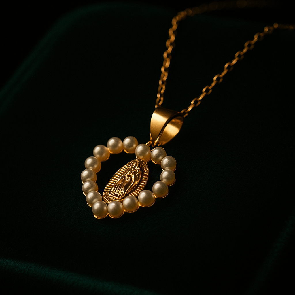 Gold necklace with a heart-shaped pendant featuring a religious figure on a dark background