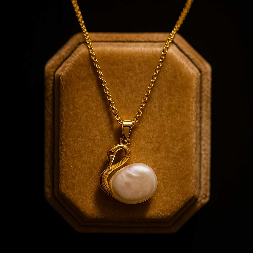 Gold necklace with a pearl pendant on a brown velvet stand against a black background
