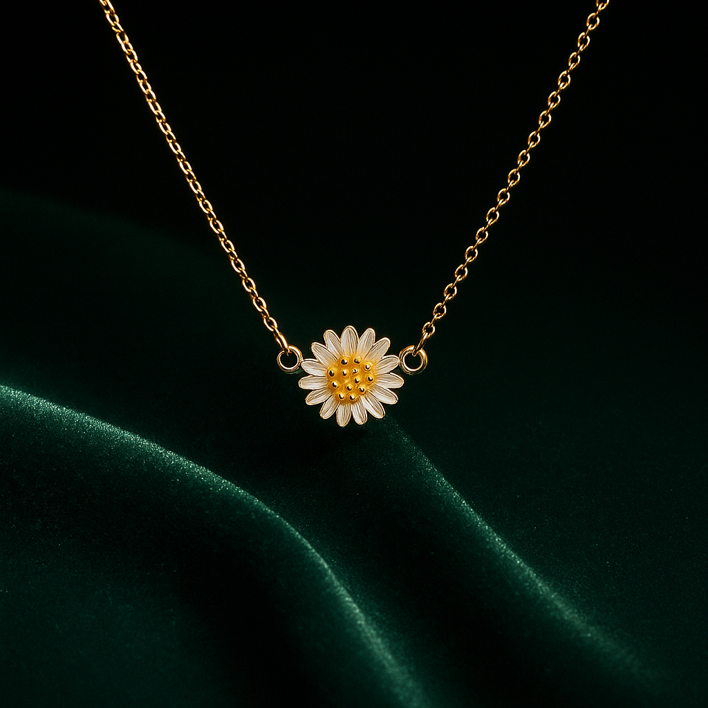 Cartier necklace with a floral pendant on a dark green fabric background