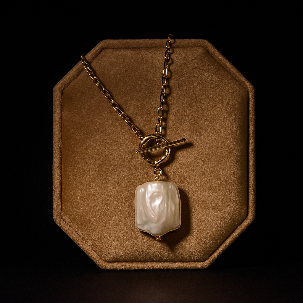 Necklace with a pendant on a brown hexagonal display stand against a black background