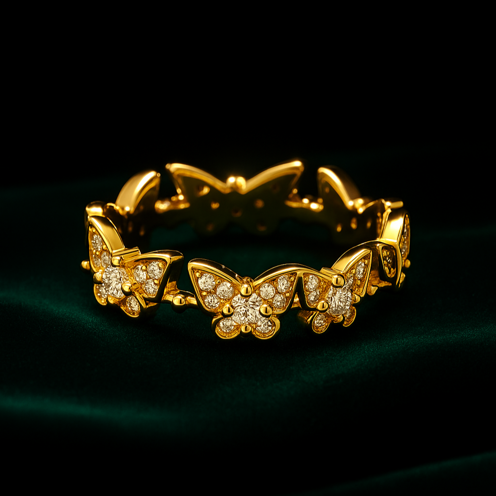 Gold butterfly bracelet with diamond accents on a dark green background