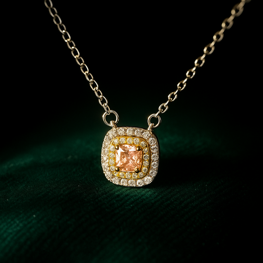 Necklace with a square pendant featuring a peach-colored gemstone on a dark background