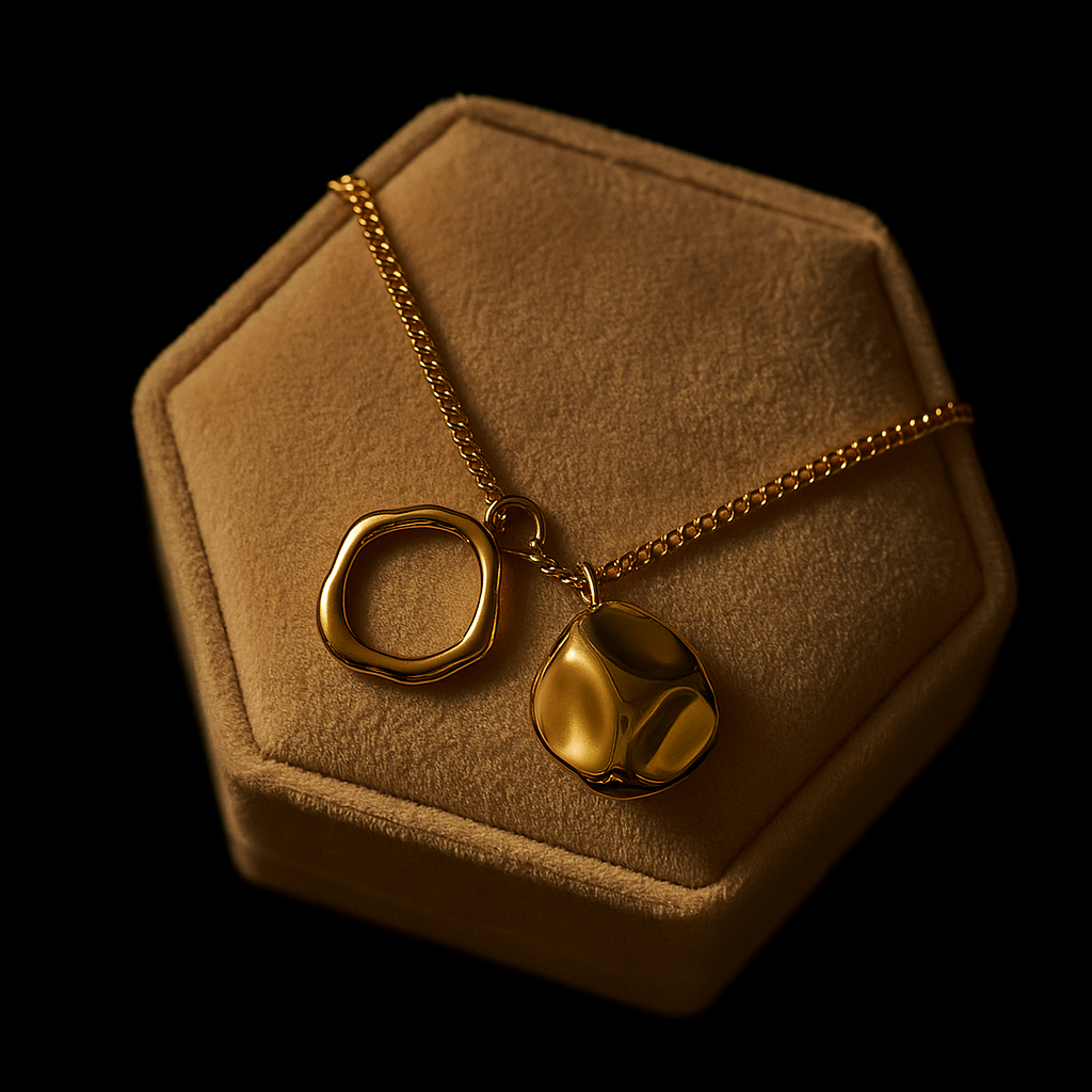 Gold necklace with a pendant on a brown hexagonal jewelry display