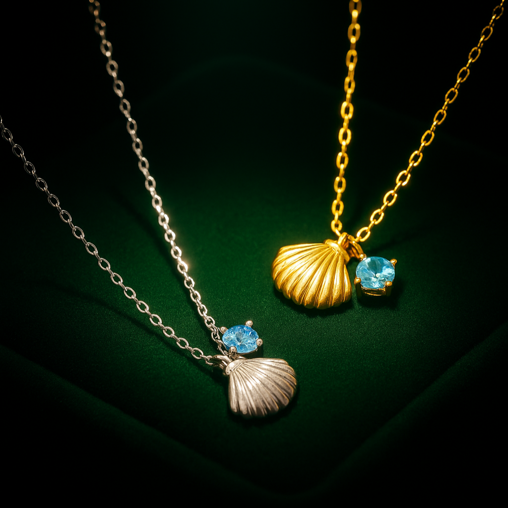 Two necklaces with shell pendants and blue gemstones on a dark background