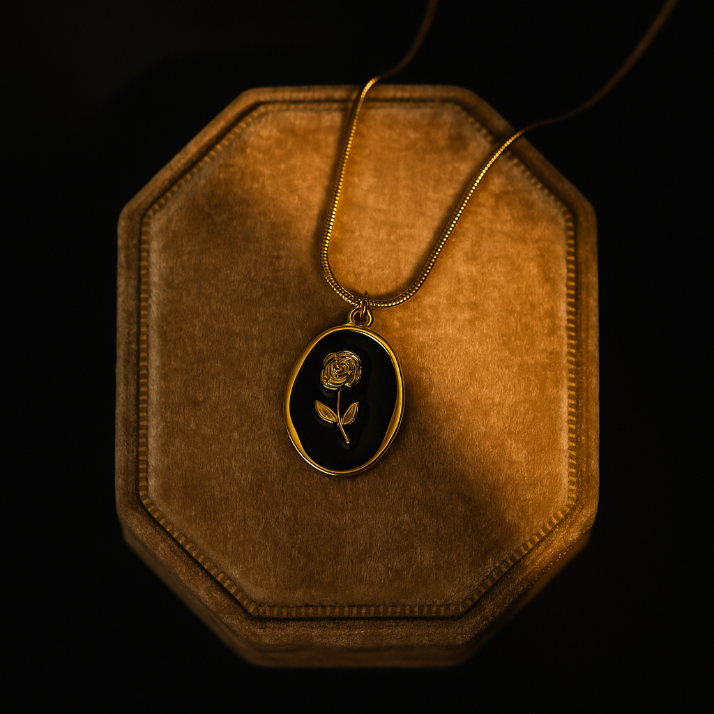 Gold necklace with a pendant on a brown velvet stand against a black background