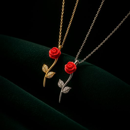 Two necklaces with red rose pendants on a dark background