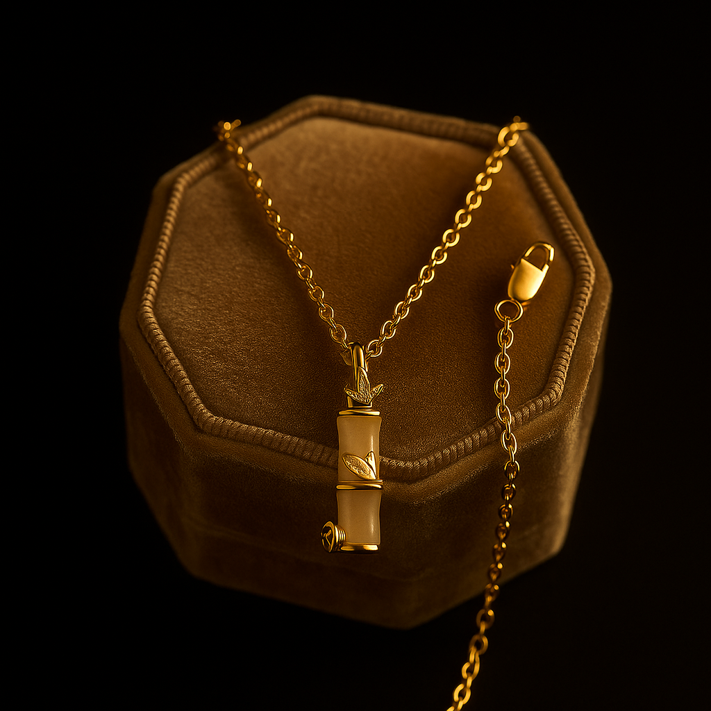 Gold necklace with a pendant on a brown hexagonal jewelry box against a black background