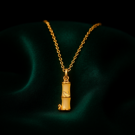 Gold necklace with a pendant on a dark background
