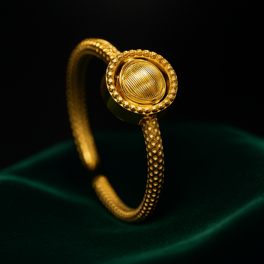 Gold bracelet on a dark background